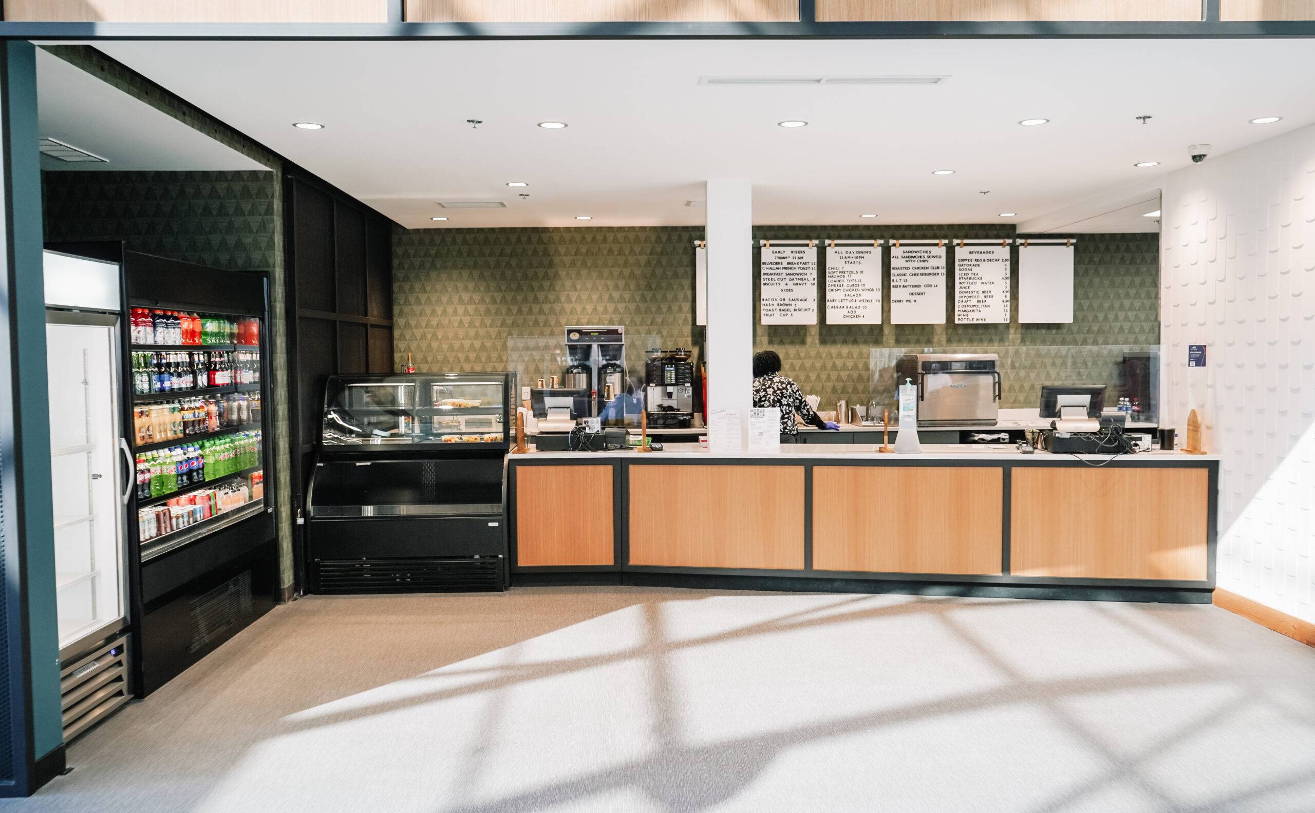 Coffee shop counter with menu boards.