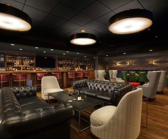 Stylish bar with leather sofas and drinks.