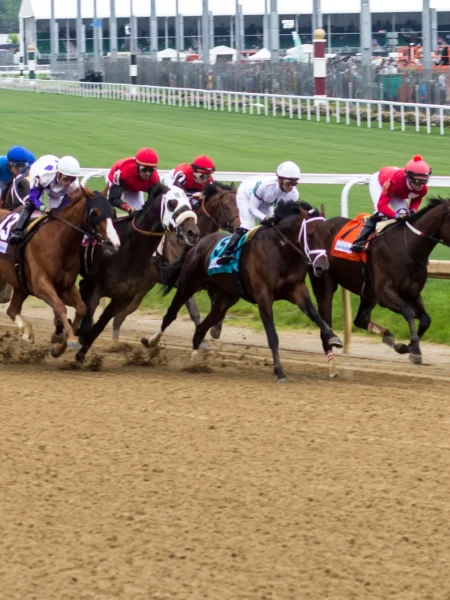 Kentucky Derby horses racing down the track at Churchill Downs